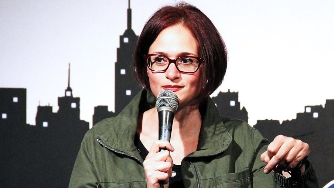 Adrienne Iapalucci performing stand-up comedy.